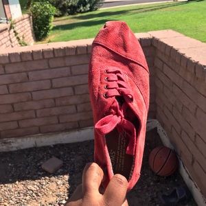 Red TOMS lace up shoes